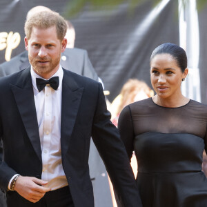 Meghan Markle, duchesse de Sussex, avec le prince Harry lors de la première du film Le Roi Lion au cinéma Odeon Luxe Leicester Square à Londres, le 14 juillet 2019.