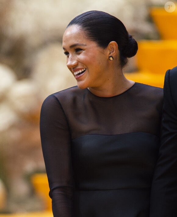 Meghan Markle, duchesse de Sussex, avec le prince Harry lors de la première du film Le Roi Lion au cinéma Odeon Luxe Leicester Square à Londres, le 14 juillet 2019.