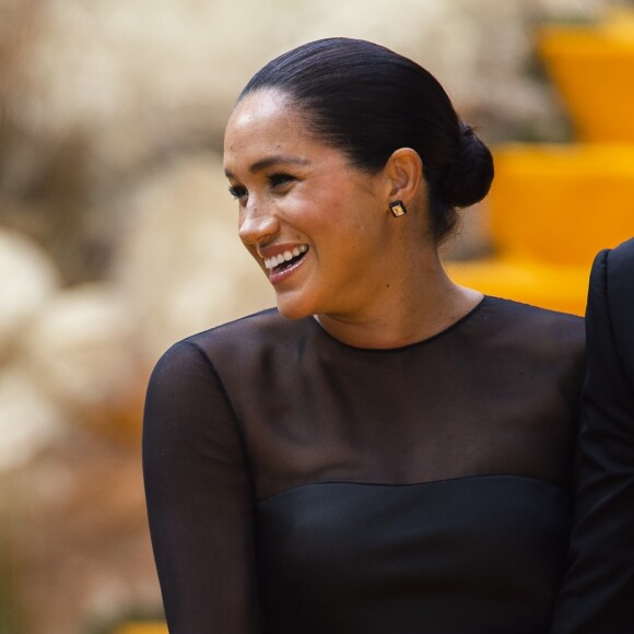 Meghan Markle, duchesse de Sussex, avec le prince Harry lors de la première du film Le Roi Lion au cinéma Odeon Luxe Leicester Square à Londres, le 14 juillet 2019.