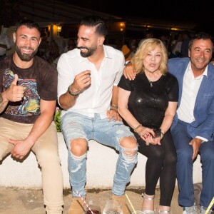 Bettina (propriétaire), Yohan Lidon (kickboxeur), Adil Rami, Nicoletta, Bernard Montiel, Jocelyn et Jean-Christophe Molinier assistent à la soirée des 50 ans de l'hôtel le Mas de Bellevue à Saint-Tropez, Côte d'Azur, France, le 8 août 2019. © Jack Tribeca/Bestimage