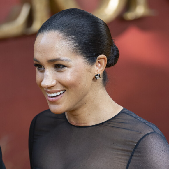 Le prince Harry, duc de Sussex, et Meghan Markle, duchesse de Sussex, à la première du film "Le Roi Lion" au cinéma Odeon Luxe Leicester Square à Londres, le 14 juillet 2019.