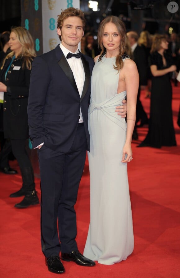 Sam Claflin et sa femme Laura Haddock - Cérémonie des BAFTA Awards à la Royal Opera House à Londres. Le 16 février 2014.