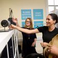 Meghan Markle (enceinte), duchesse de Sussex, en visite dans les locaux de l'association "Smart Works" à Londres. Le 10 janvier 2019  The Duchess of Sussex (centre) picks out clothes with Patsy Wardally during her visit to Smart Works, in London, on the day that she has become their patron, as well as patron of the National Theatre, the Association of Commonwealth Universities, and the animal welfare charity, Mayhew.10/01/2019 - Londres