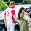 Le prince Harry, duc de Sussex, Meghan Markle, duchesse de Sussex, et leur fils Archie Mountbatten-Windsor lors d'un match de polo de bienfaisance à Wokinghan le 10 juillet 2019.