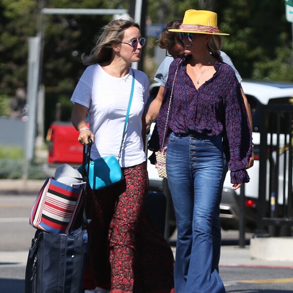 Laeticia Hallyday et son compagnon Pascal Balland avec Marine, l'ex-femme de Pascal Balland, à Los Angeles, avant d'aller chercher leurs filles à l'école. Le 13 septembre 2019