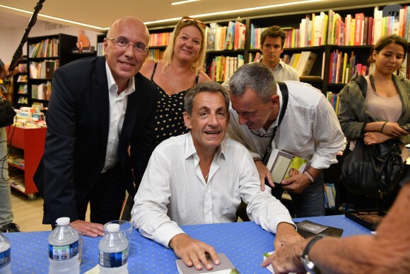 Exclusif - Nicolas Sarkozy, ancien président de la République, rencontre Eric Ciotti, le Député et Conseiller Départemental des Alpes Maritimes, lors de sa séance de dédicaces son livre "Passions", à la librairie Jean Jaurès de Nice, France, le lundi 26 août 2019. © Bruno Bebert/Bestimage