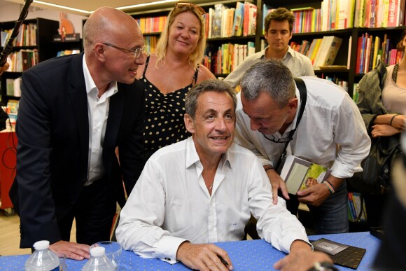 Exclusif - Nicolas Sarkozy, ancien président de la République, rencontre Eric Ciotti, le Député et Conseiller Départemental des Alpes Maritimes, lors de sa séance de dédicaces son livre "Passions", à la librairie Jean Jaurès de Nice, France, le lundi 26 août 2019. © Bruno Bebert/Bestimage