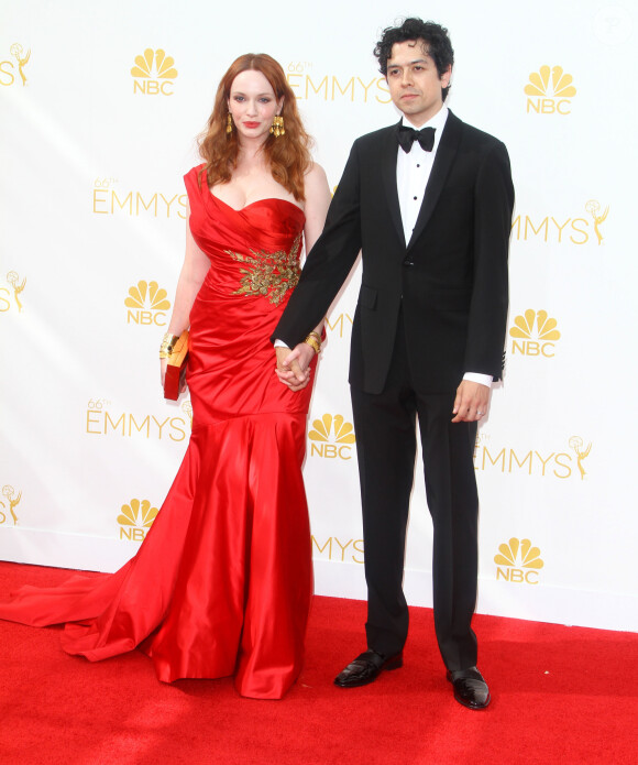 Christina Hendricks et son mari Geoffrey Arend - 66e cérémonie annuelle des Emmy Awards au Nokia Theatre à Los Angeles, le 25 août 2014.