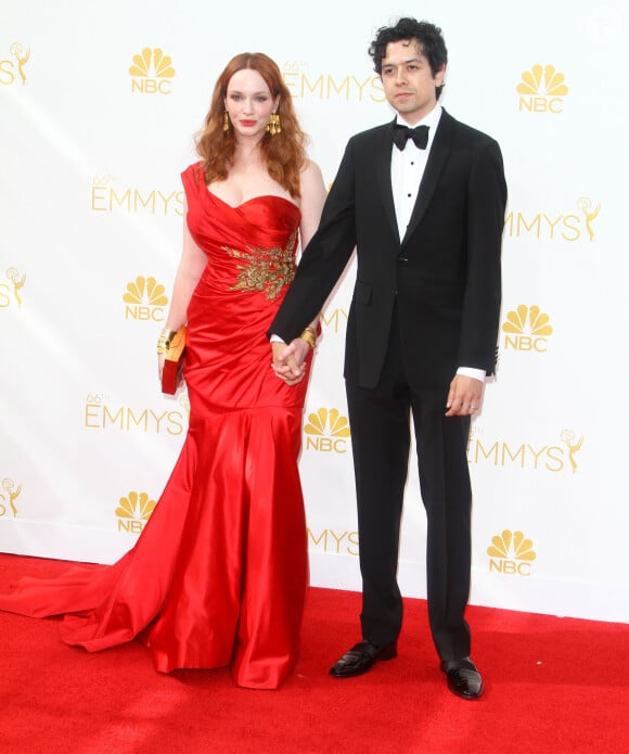 Christina Hendricks et son mari Geoffrey Arend à la 66e cérémonie annuelle des Emmy Awards au Nokia Theatre à Los Angeles, le 25 août 2014.