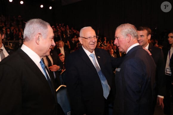 Le Premier ministre israélien Benjamin Netanyahu, le président israélien Reuven Rivlin, le prince Charles et Emmanuel Macron à la cérémonie marquant à Jérusalem le 75e anniversaire de la libération du camp nazi d'Auschwitz, le 23 janvier 2020, au Mémorial de Yad Vashem.