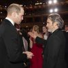 Le prince William, duc de Cambridge et Joaquin Phoenix lors de la 73e cérémonie des British Academy Film Awards (BAFTA) au Royal Albert Hall à Londres, le 2 février 2020.