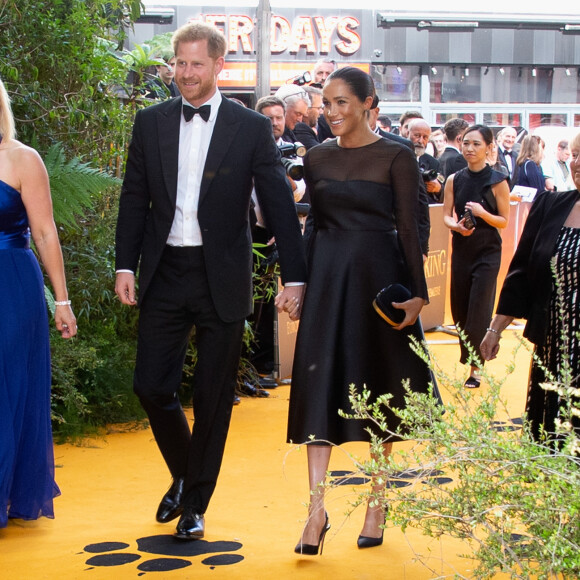Le prince Harry, duc de Sussex, et Meghan Markle, duchesse de Sussex, à la première du film "Le Roi Lion" au cinéma Odeon Luxe Leicester Square à Londres, le 14 juillet 2019.