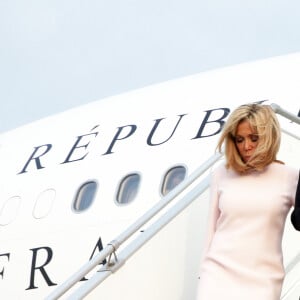 Brigitte Macron, Première dame et son mari Emmanuel Macron, président de la République française - Déplacement en Côte d'Ivoire - Arrivée du Président de la République et de sa femme à l'aéroport international Félix Houphouët Boigny à Abidjan le 20 décembre 2019. © Dominique Jacovides / Bestimage