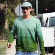 Exclusif - Brad Pitt , pull vert et casquette assortie se rend à un meeting à Los Angeles le 21 Février 2020.