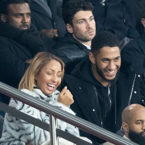 Tony Yoka et sa femme Estelle Mossely (enceinte de son deuxième enfant) de nouveau ensemble dans les tribunes lors du match de Ligue 1 opposant le Paris Saint-Germain à l'AS Monaco au Parc des Princes à Paris, France, le 12 janvier 2020. Le PSG fait match nul face à l'AS Monaco (3-3).