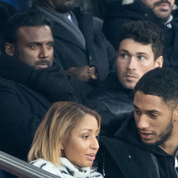 Tony Yoka et sa femme Estelle Mossely (enceinte de son deuxième enfant) de nouveau ensemble dans les tribunes lors du match de Ligue 1 opposant le Paris Saint-Germain à l'AS Monaco au Parc des Princes à Paris, France, le 12 janvier 2020. Le PSG fait match nul face à l'AS Monaco (3-3).