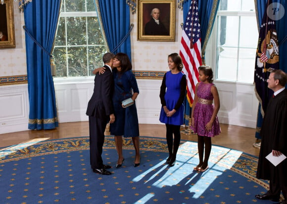 Barack et Michelle Obama avec leurs filles Malia et Sasha à la Maison Blanche en 2013.