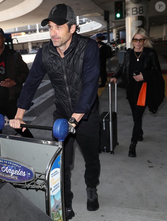 Patrick Dempsey et sa femme Jillian Fink arrivent à aéroport de LAX, Los Angeles, le 19 février 2020.