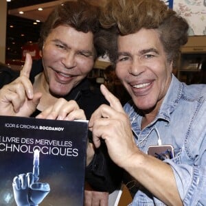 Les frères Igor et Grichka Bogdanov lors de la 37ème édition du Salon du livre au parc des expositions, à la porte de Versailles, à Paris, France, le 26 mars 2017. © Cédric Perrin/Bestimage