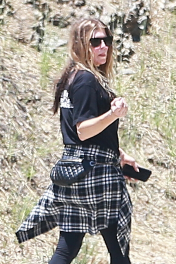 Exclusif - Fergie se balade seule dans le quartier de Brentwood à Los Angeles, le 9 juin 2019.