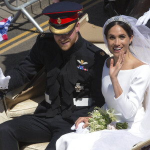 Le prince Harry, duc de Sussex, et Meghan Markle, duchesse de Sussex, en calèche au château de Windsor après la cérémonie de leur mariage au château de Windsor, Royaume Uni, le 19 mai 2018.