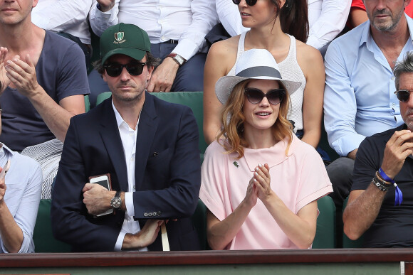 Antoine Arnault and Natalia Vodianova with her son attend the third round  of the French Tennis