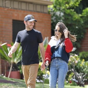 Exclusif - Eclats de rire entre Lily Collins et son compagnon Charlie McDowell pendant leur promenade à Beverly Hills avec leur chien Redford, le 7 avril 2020.