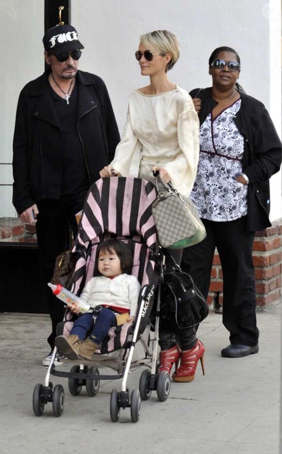 Johnny Hallyday, sa femme Laetitia et leur fille Joy, le 6 janvier 2010