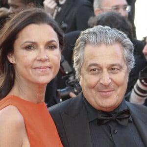 Christian Clavier et sa compagne Isabelle De Araujo lors de la première du film "The Immigrant" lors du 66e Festival du Film de Cannes, le 24 mai 2014 