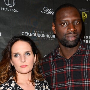 Omar Sy et sa femme Hélène au vernissage de l'exposition "Vision by AG", au profit de l'association caritative CeKeDuBonheur, à la Piscine Molitor à Paris. © Guirec Coadic/Bestimage