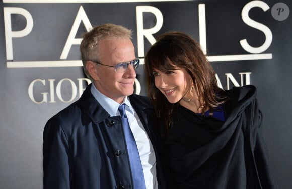 Sophie Marceau et son compagnon Christophe Lambert - Arrivee des people au defile Giorgio Armani Haute Couture Printemps/Ete 2014 au Palais de Tokyo a Paris, le 21 janvier 2014.