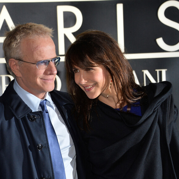 Sophie Marceau et son compagnon Christophe Lambert - Arrivee des people au defile Giorgio Armani Haute Couture Printemps/Ete 2014 au Palais de Tokyo a Paris, le 21 janvier 2014.
