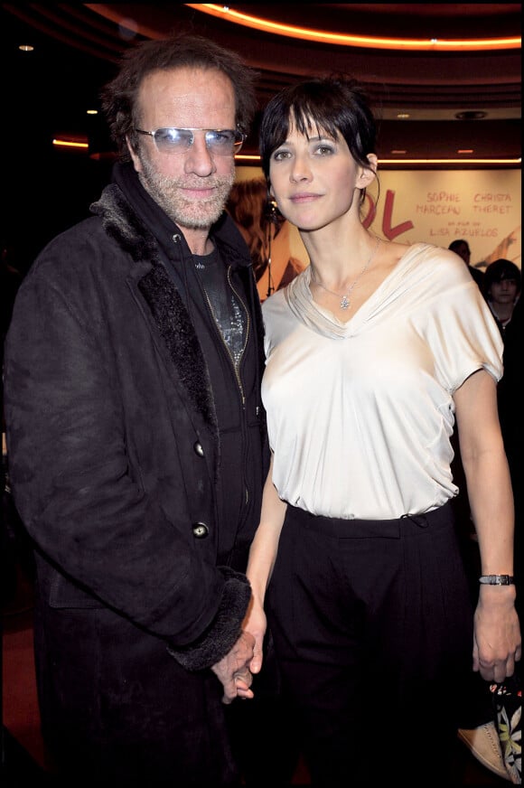 Christophe Lambert et Sophie Marceau- Première du film "LOL" au cinéma Gaumont Marignan à Paris.