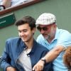 Antoine Duléry et son fils Raphaël dans les tribunes lors des internationaux de France de Roland Garros à Paris, le 2 juin 2017. © Dominique Jacovides-Cyril Moreau/Bestimage 