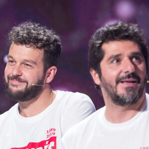 Exclusif - Claudio Capéo, Patrick Fiori - Enregistrement de l'émission "Les enfoirés jouent le jeu", qui sera diffusée le 30 novembre en prime time sur TF1. Le 18 novembre 2019 © Cyril Moreau / Bestimage A l'occasion des 30 ans de la troupe des Enfoirés et de la sortie du Coffret " Les 30 ans des Enfoirés 1989-2019 " au profit des Restos du Coeur, des Enfoirés et des surprises se retrouvent autour de N.Aliagas pour une grande soirée de jeux. Des jeux en cascades, des questions en rafales, des karaokés, des blind tests, des mimes... Et une grande finale pour déterminer, de tous les Enfoirés présents, qui sera le grand vainqueur de la soirée. 