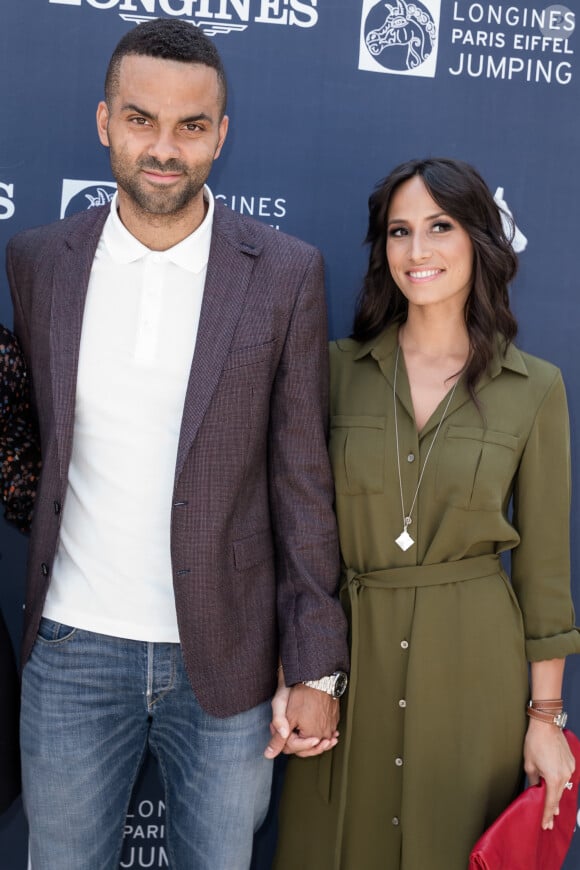 Exclusif - Tony Parker et sa femme Axelle Francine - People lors du Longines Paris Eiffel Jumping au Champ-de-Mars à Paris, le 5 juillet 2015.