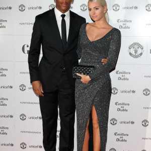 Anthony Martial et sa compagne Mélanie da Cruz sont apparus pour la première fois en public au photocall du dîner de gala "The United for UNICEF" au stade Old Trafford à Manchester, Royaume Uni, le 31 octobre 2016.