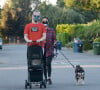 Exclusif - Macaulay Culkin et sa compagne Brenda Song promènent leur chat en poussette dans le rues de Los Angeles. Le 13 octobre 2020.