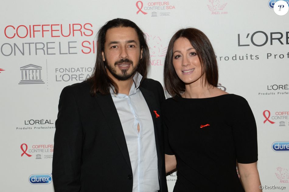 Moundir et sa femme Inès lors de l'opération " Coiffeurs Contre le Sida " édition 2014 à l'Académie L'Oréal Produits Professionnels à Paris, le 1er décembre 2014.