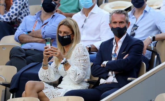 Jean-Claude Blanc et sa femme dans les tribunes des Internationaux de France de Roland Garros à Paris le 11 juin 2021. © Dominique Jacovides / Bestimage 