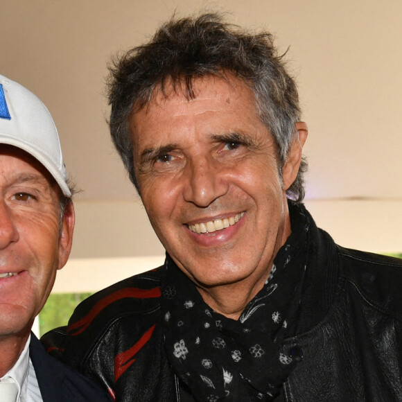 Philippe Rozier et Julien Clerc - Les personnalités assistent au Longines Paris Eiffel Jumping au Champ de Mars, le 27 juin 2021. © Veeren / Bestimage 