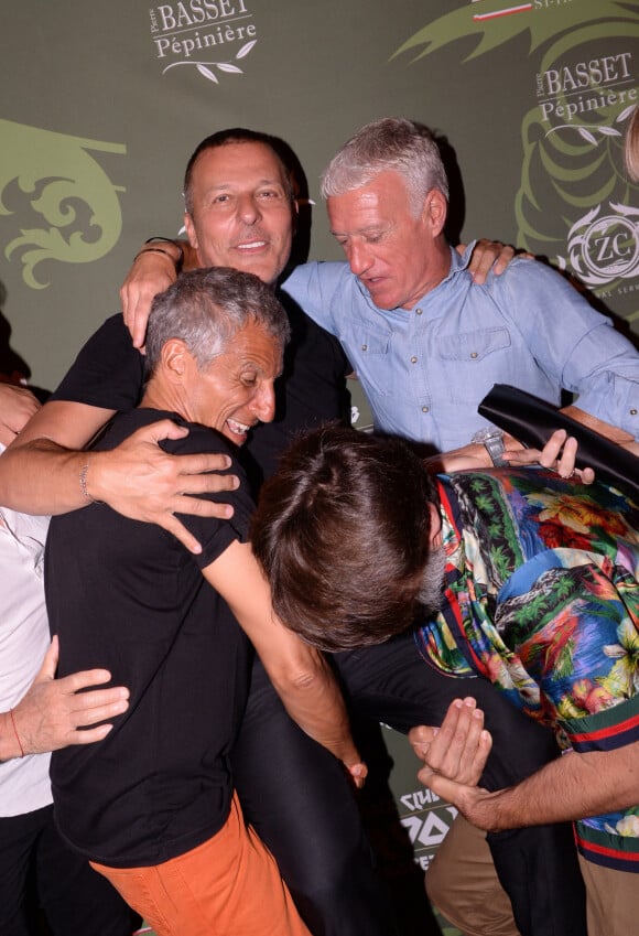 Exclusif - Nagui, Jean-Roch, Didier Deschamps au VIP Room à Saint-Tropez au mois de juillet 2019. © Rachid Bellak/Bestimage