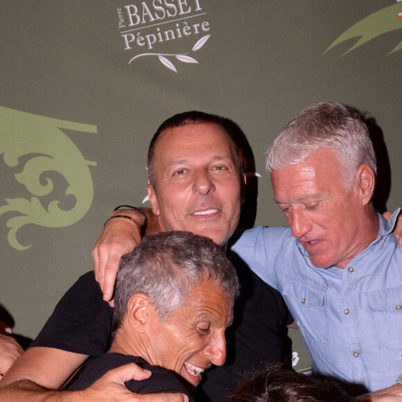 Exclusif - Nagui, Jean-Roch, Didier Deschamps au VIP Room à Saint-Tropez au mois de juillet 2019. © Rachid Bellak/Bestimage