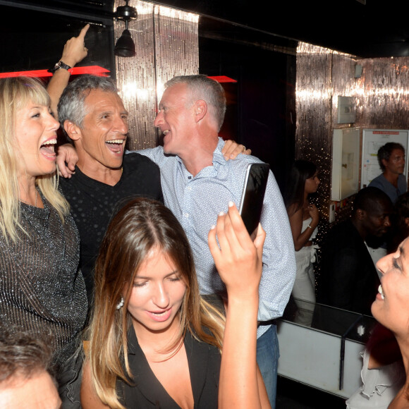 Semi-Exclusif - Didier Deschamps fête sa victoire avec Nagui et sa femme Mélanie Page, Leïla Kaddour-Boudadi et des amis au VIP Room à Saint-Tropez, le 21 juillet 2018. © Rachid Bellak/Bestimage