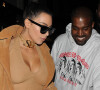 Kim Kardashian, (portant un collier "SEX") et son mari Kanye West quittent le restaurant "Hakkasan", situé dans le quartier de Mayfair à Londres, le 20 mai 2016.