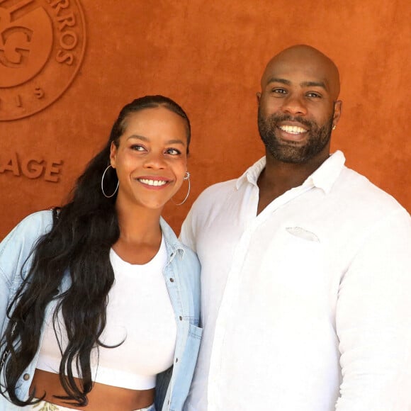 Teddy Riner et sa compagne Luthna Plocus au village lors des internationaux de France Roland Garros à Paris. © Dominique Jacovides / Bestimage