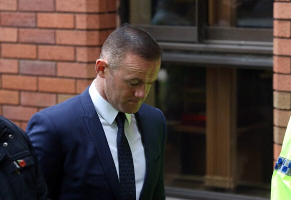 Wayne Rooney quitte le Palais de justice de Stockport. Il comparait pour conduite en état d'ébriété, le 18 septembre 2017.