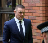 Wayne Rooney quitte le Palais de justice de Stockport. Il comparait pour conduite en état d'ébriété.