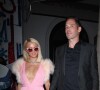 Paris Hilton, vêtue d'une robe Valentino rose, et son compagnon Carter Reum quittent la soirée précédant les Oscar au restaurant "Craig's" à Los Angeles, le 21 avril 2021. 