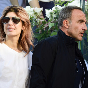 Nikos Aliagas et sa femme Tina dans les tribunes lors des internationaux de tennis de Roland Garros à Paris, France, le 31 mai 2019. © Jean-Baptiste Autissier/Panoramic/Bestimage